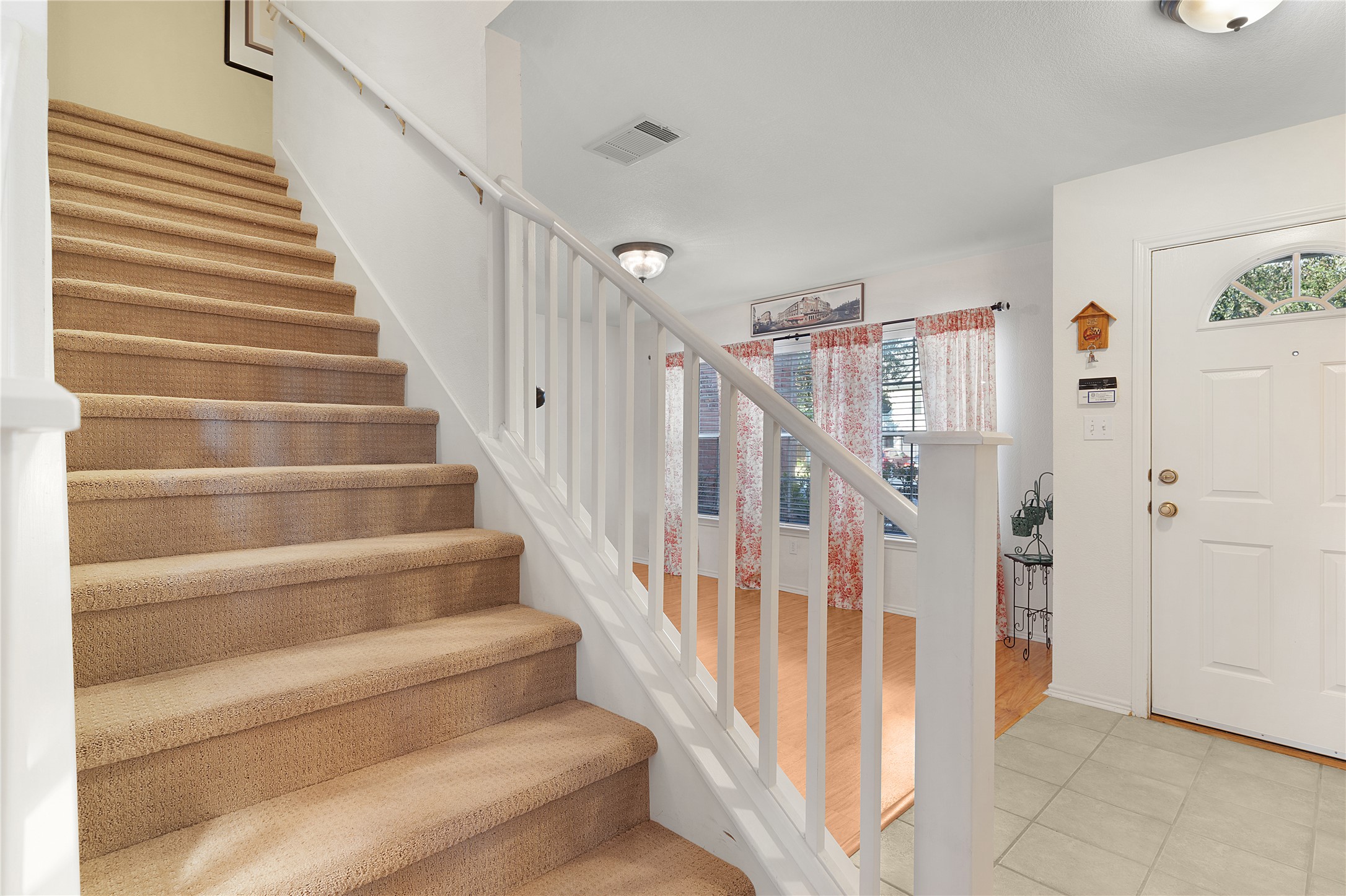 2305 Little Tree Bend Cedar Park, TX 78613 - Photo 19 of 40 a view of staircase with lots of frames on wall and a baby crib