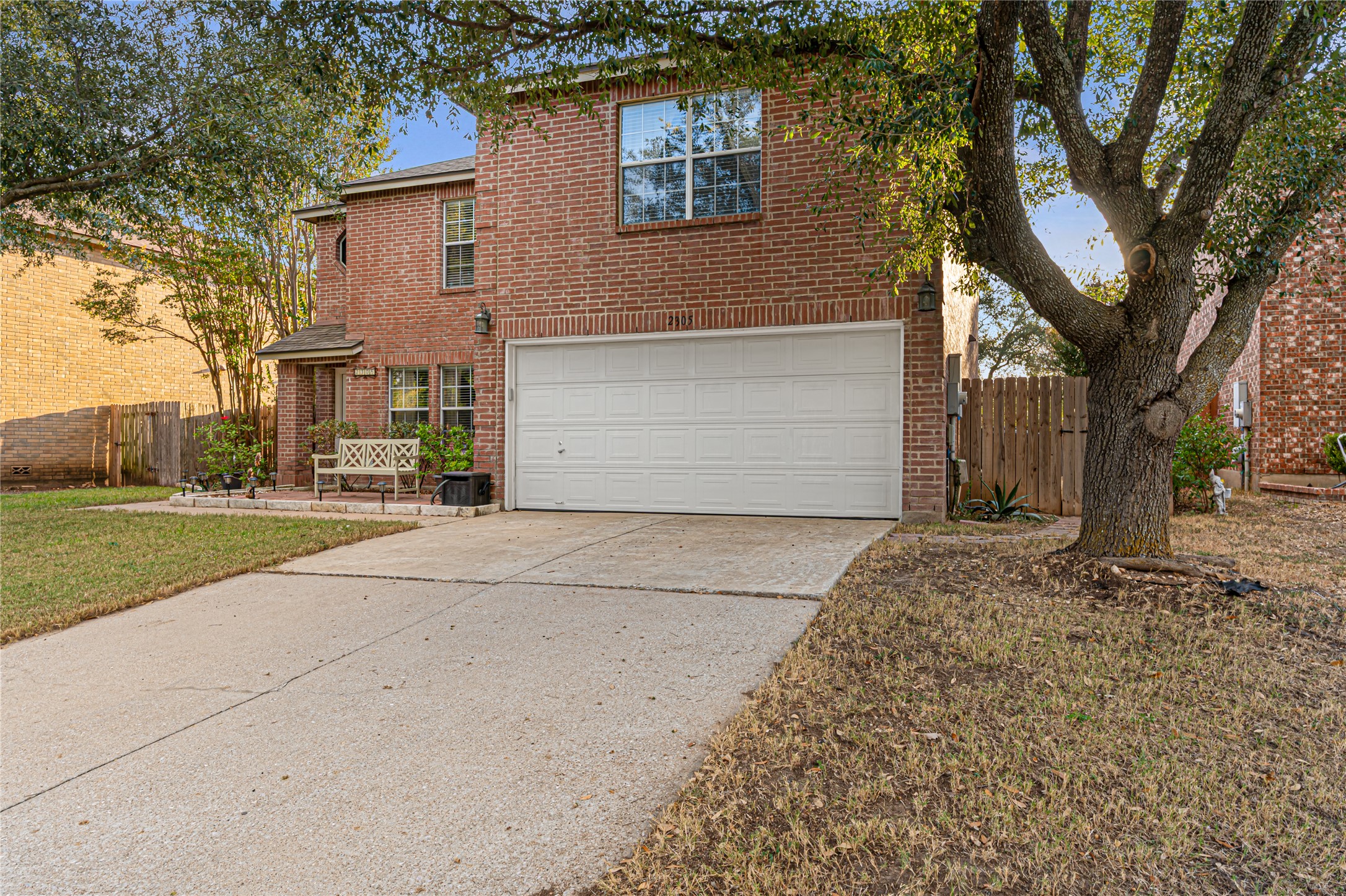 2305 Little Tree Bend Cedar Park, TX 78613 - Photo 2 of 40 a front view of a house with a yard and garage