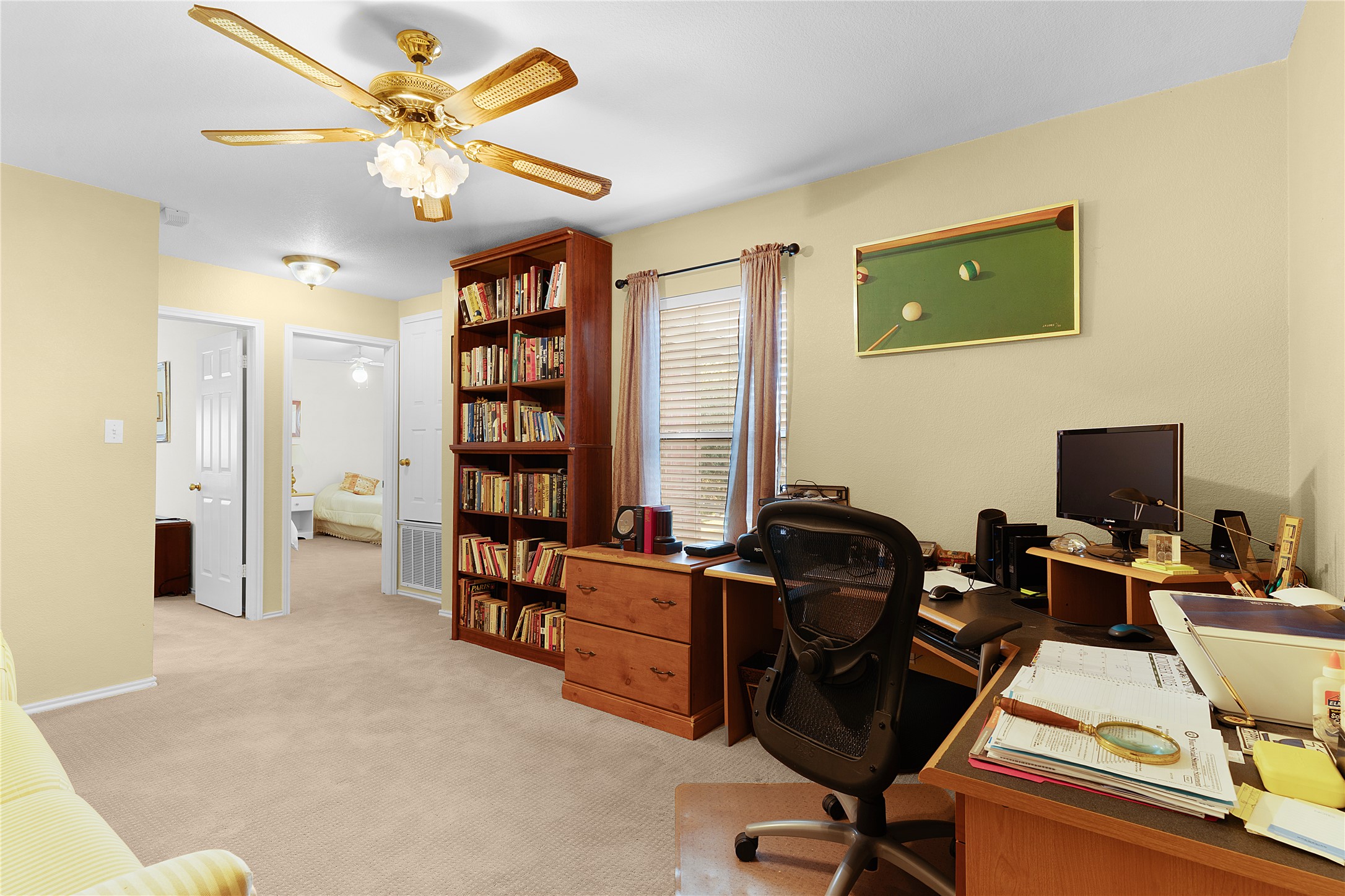 2305 Little Tree Bend Cedar Park, TX 78613 - Photo 21 of 40 a view of a workspace with furniture and bookshelf