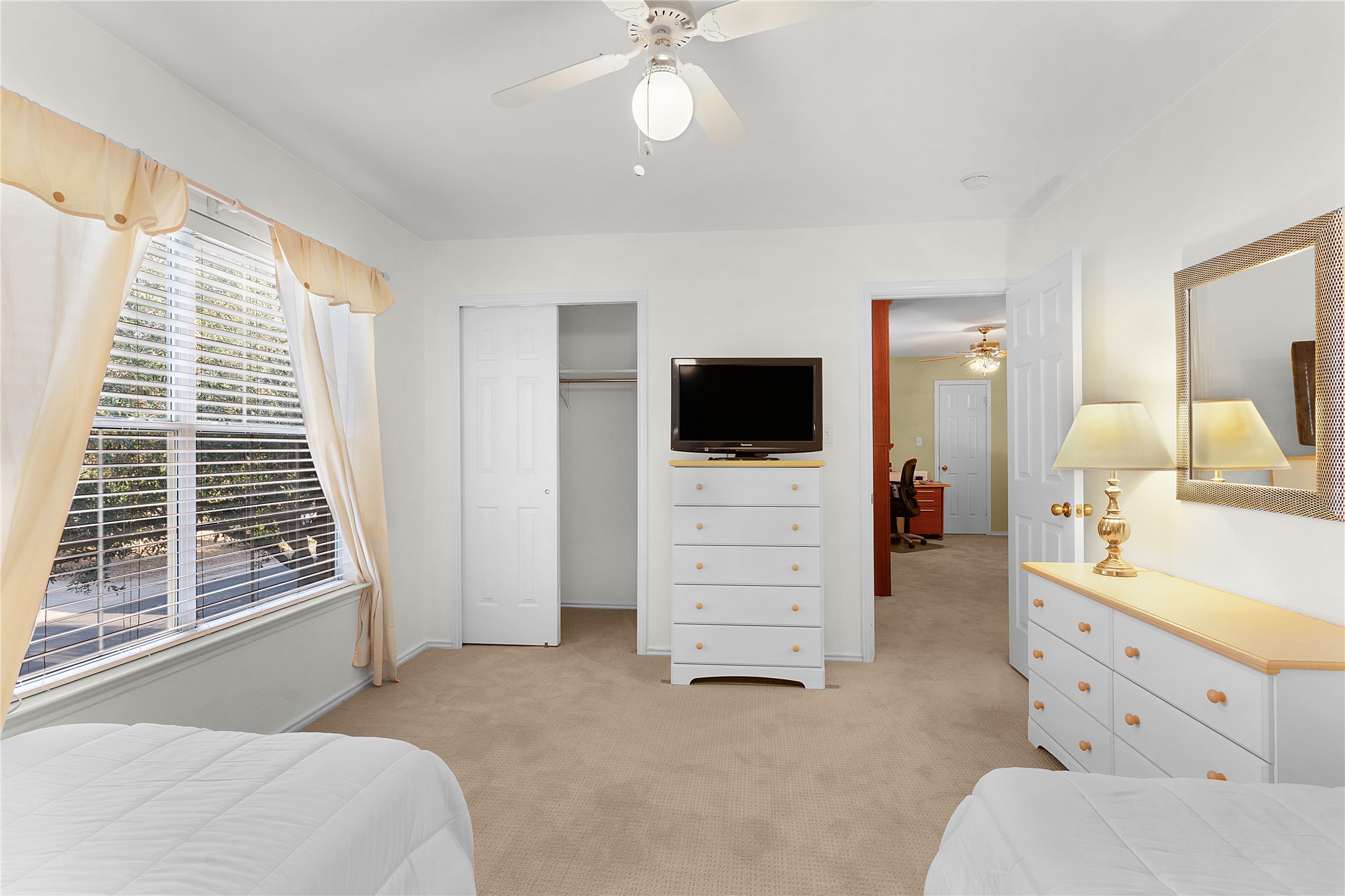 2305 Little Tree Bend Cedar Park, TX 78613 - Photo 23 of 40 a bedroom with a bed and a flat tv screen on dresser