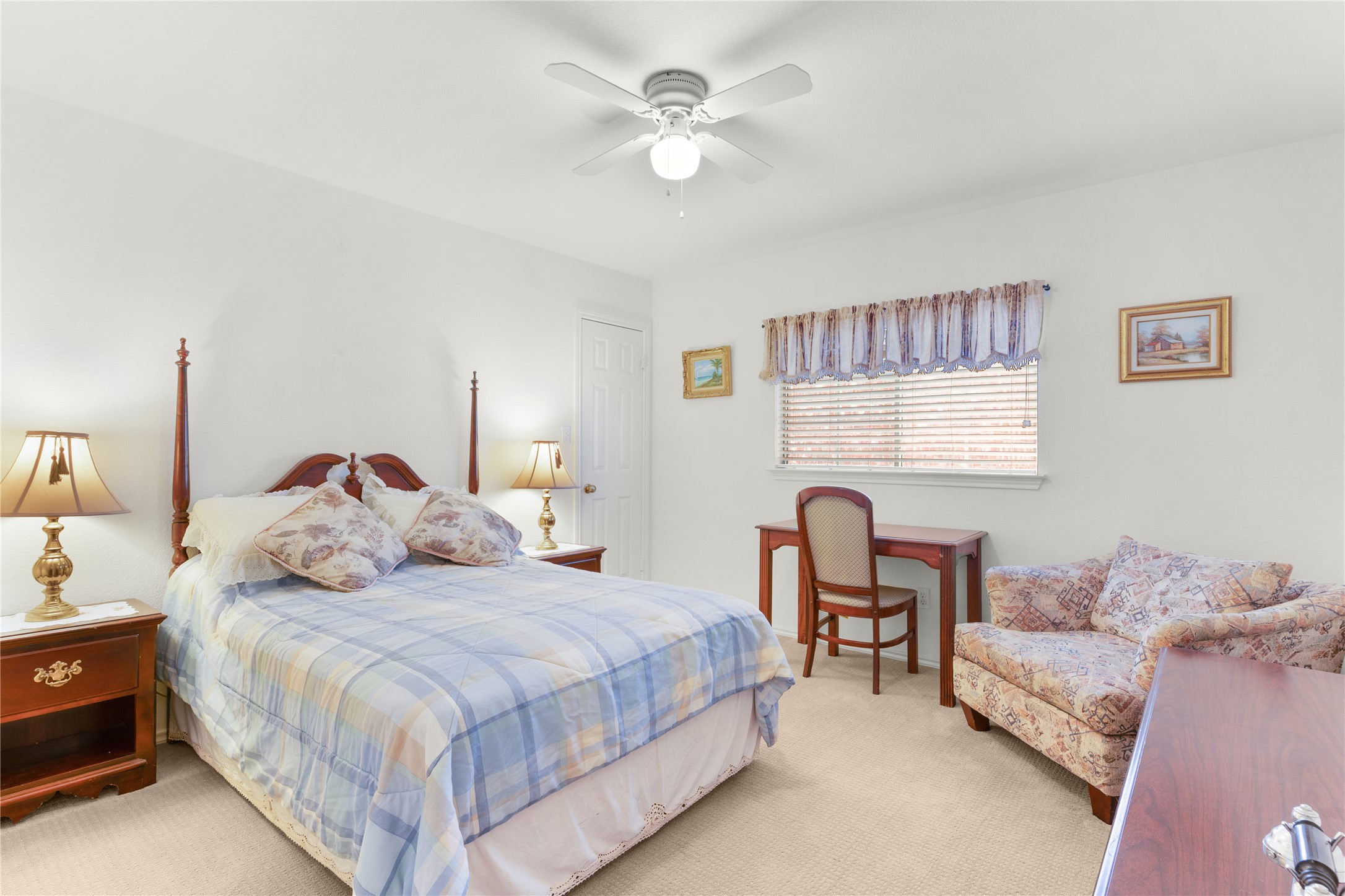 2305 Little Tree Bend Cedar Park, TX 78613 - Photo 25 of 40 a bedroom with a bed couch and a large window
