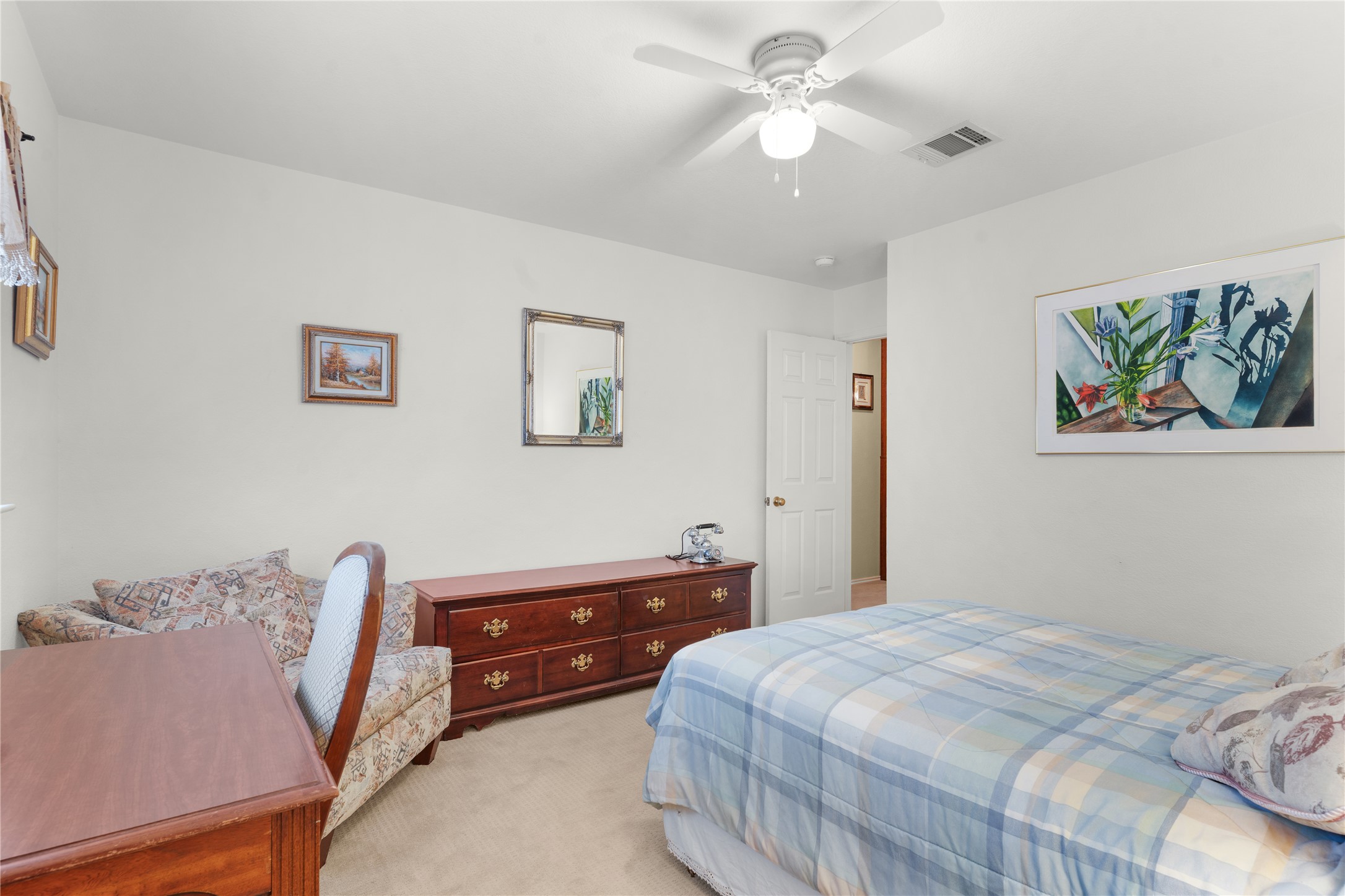2305 Little Tree Bend Cedar Park, TX 78613 - Photo 26 of 40 a bedroom with a bed and a chandelier
