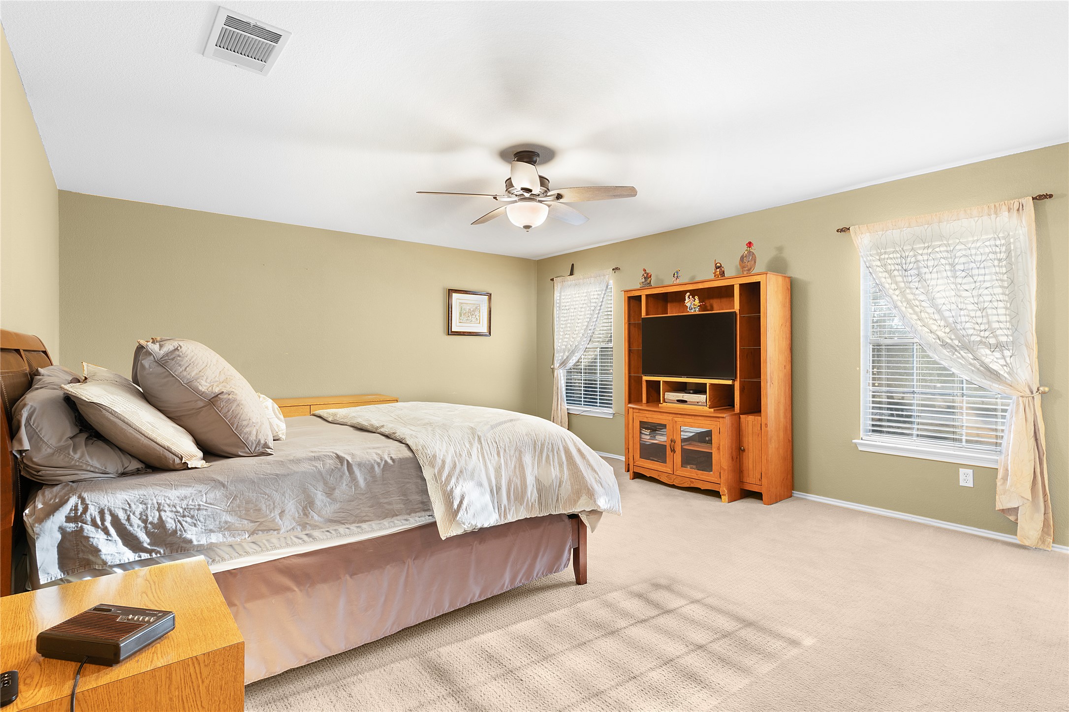 2305 Little Tree Bend Cedar Park, TX 78613 - Photo 28 of 40 a bedroom with a bed and a flat screen tv