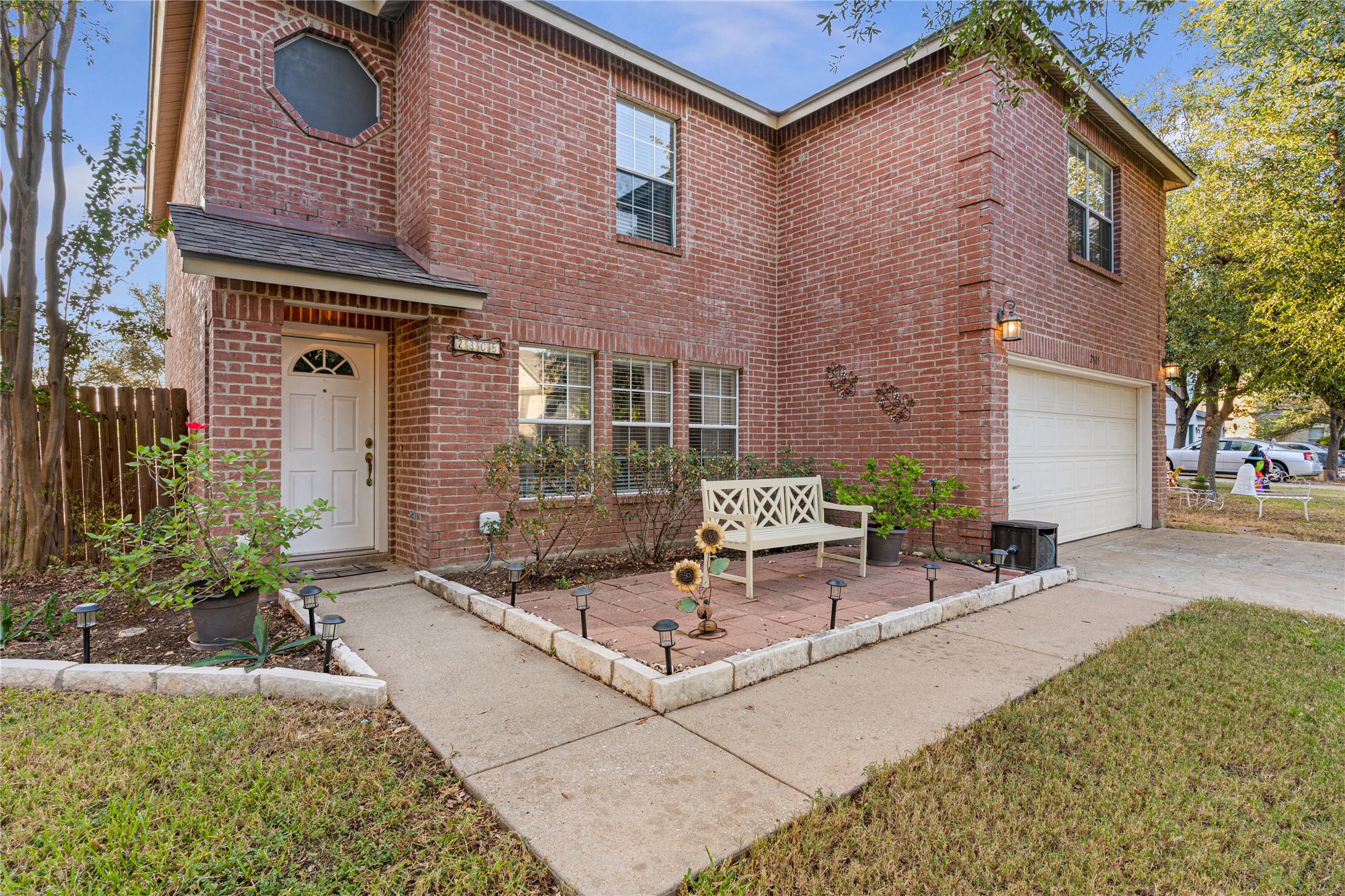 2305 Little Tree Bend Cedar Park, TX 78613 - Photo 3 of 40 a view of a brick house with chairs in patio