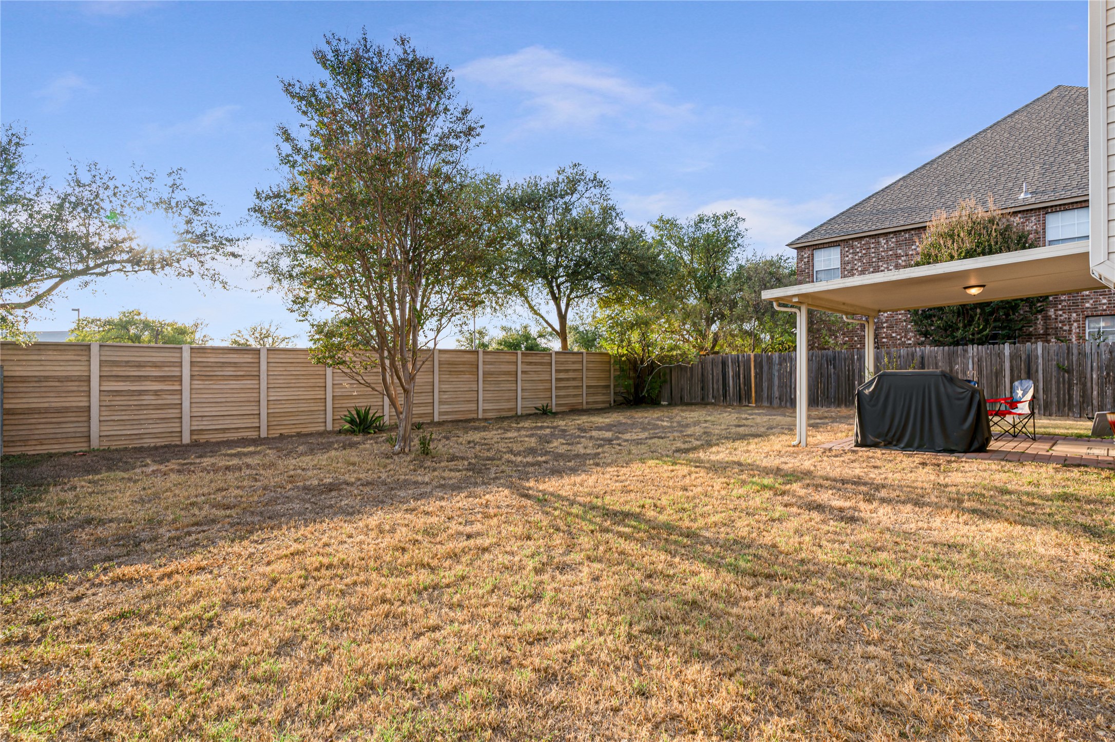 2305 Little Tree Bend Cedar Park, TX 78613 - Photo 35 of 40 a view of a backyard with large trees