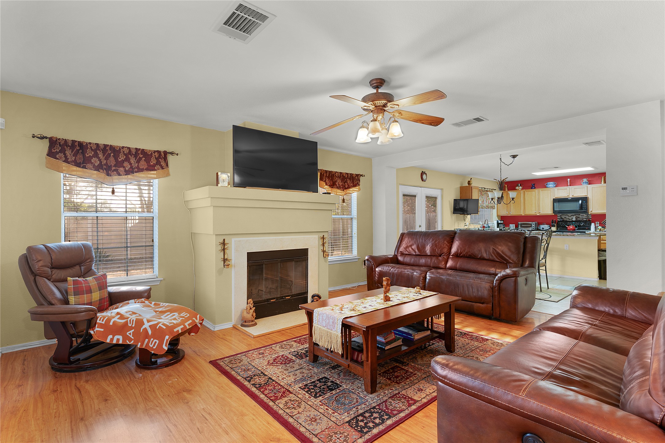 2305 Little Tree Bend Cedar Park, TX 78613 - Photo 8 of 40 a living room with furniture a fireplace and a flat screen tv