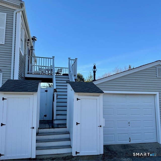 8 Broad Street, Unit 3 Stonington, CT 06378 - Photo 2 of 23 Exterior stairs lead to 2nd level entry, 1bay garage