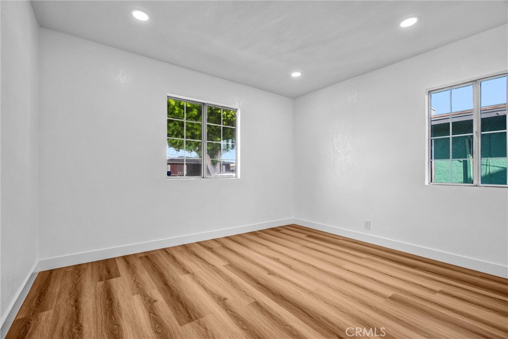1200 South Castlegate Avenue Compton, CA 90221 - Photo 18 of 39 a view of room with window and hardwood floor