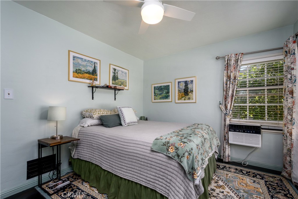 13739 Ridge Road Whittier, CA 90601 - Photo 14 of 42 a bedroom with a bed and wooden floor