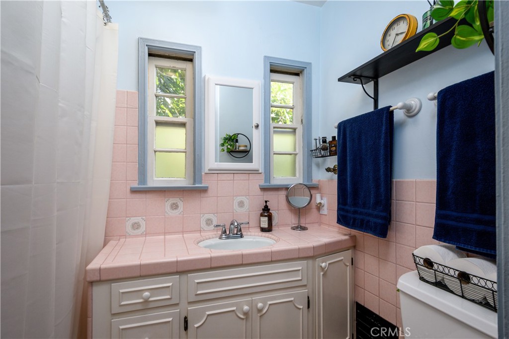 13739 Ridge Road Whittier, CA 90601 - Photo 18 of 42 a bathroom with a sink and a mirror