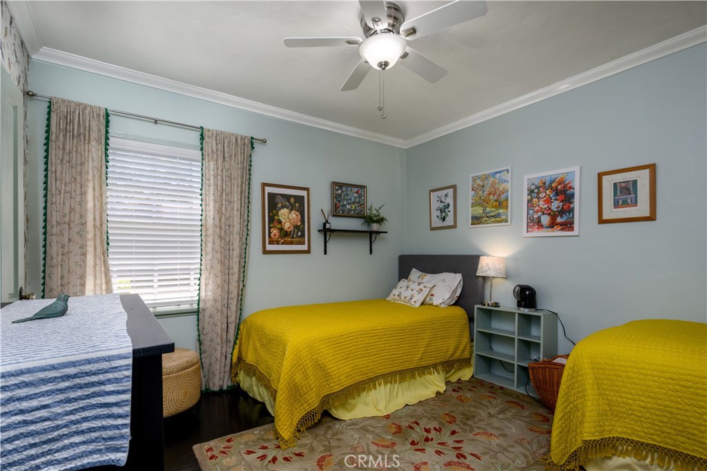 13739 Ridge Road Whittier, CA 90601 - Photo 20 of 42 a bedroom with a bed and wooden floor