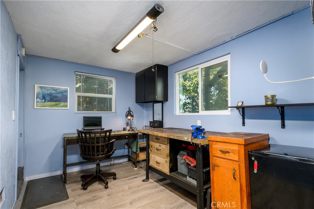 13739 Ridge Road Whittier, CA 90601 - Photo 31 of 42 a view of a workspace with furniture and a window