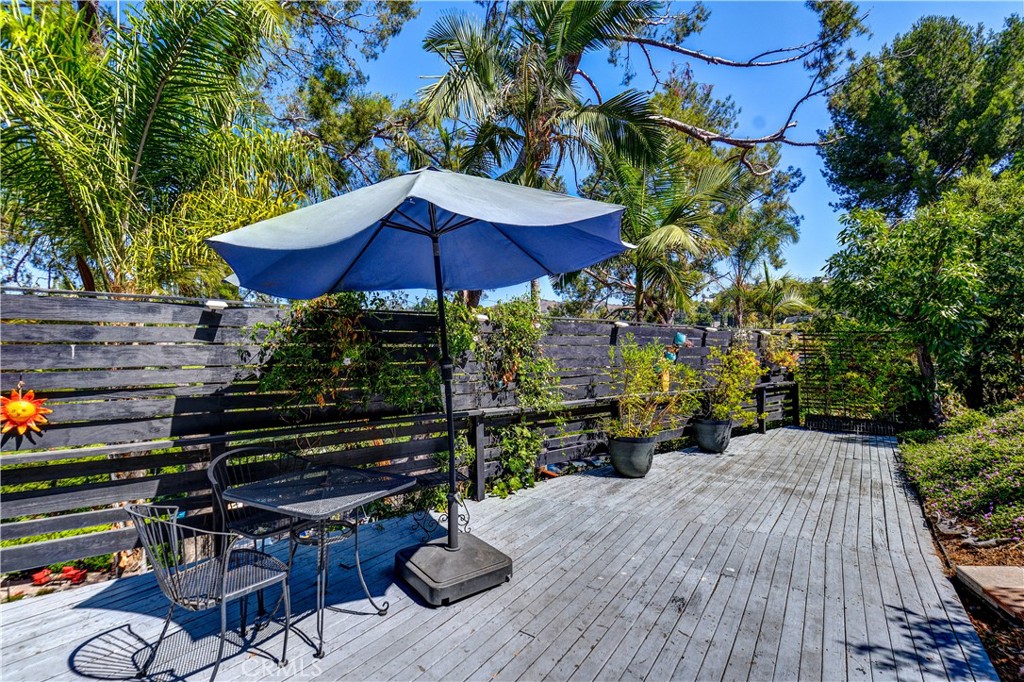 13739 Ridge Road Whittier, CA 90601 - Photo 35 of 42 a view of deck with wooden floor and outdoor seating