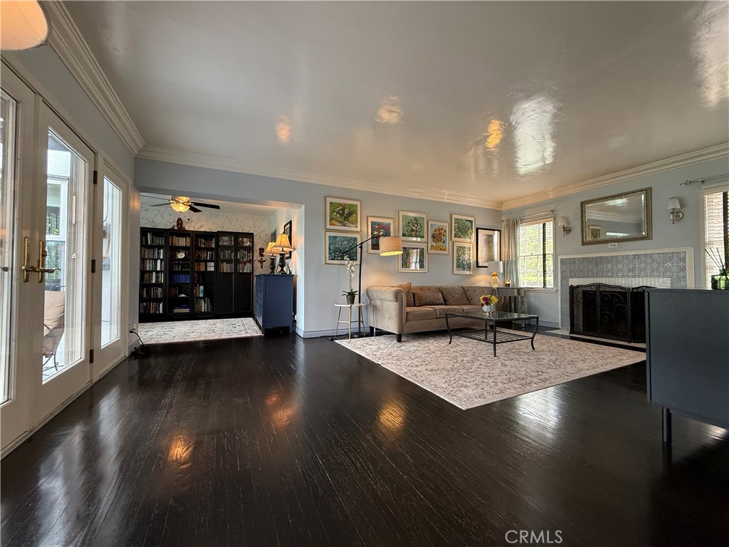 13739 Ridge Road Whittier, CA 90601 - Photo 9 of 42 a living room with fireplace furniture and a wooden floor