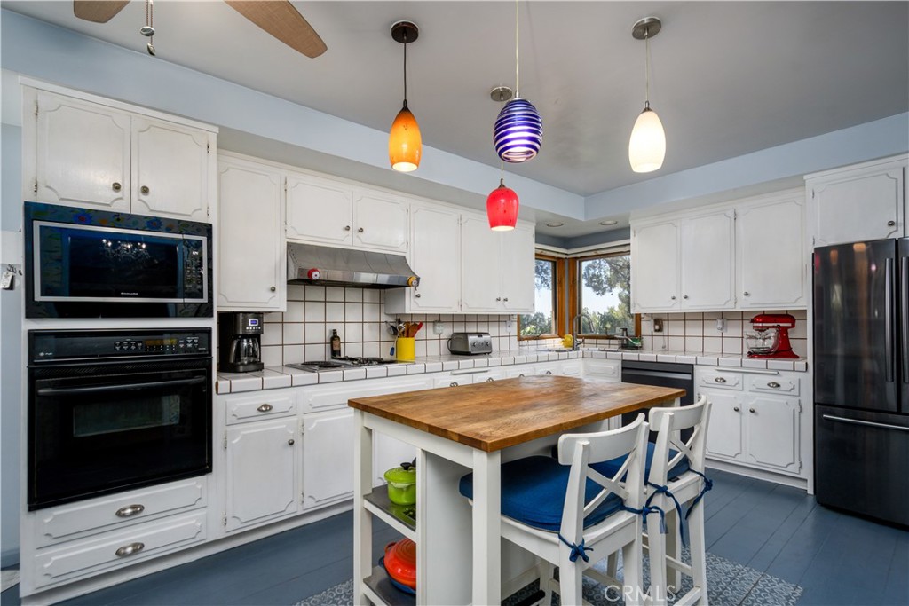 13739 Ridge Road Whittier, CA 90601 - Photo 10 of 42 a kitchen with granite countertop a sink appliances and cabinets