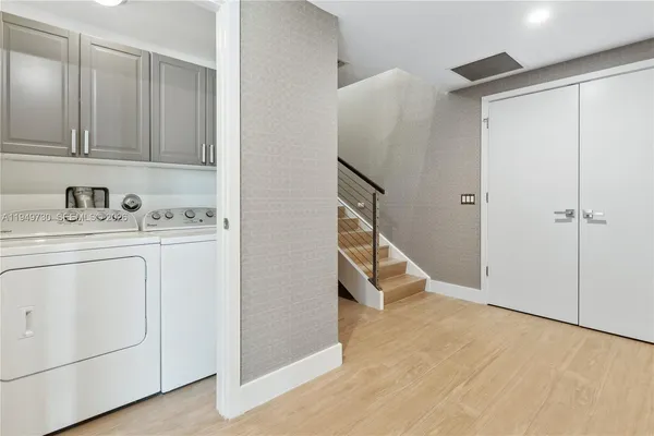 a view of storage and utility room with washer and dryer