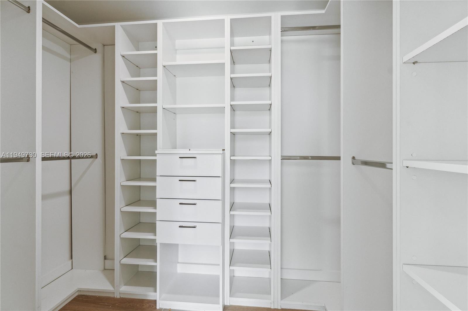1080 Brickell Avenue, Unit 1401 Miami, FL 33131 - Photo 18 of 27 a view of walk in closet with empty racks