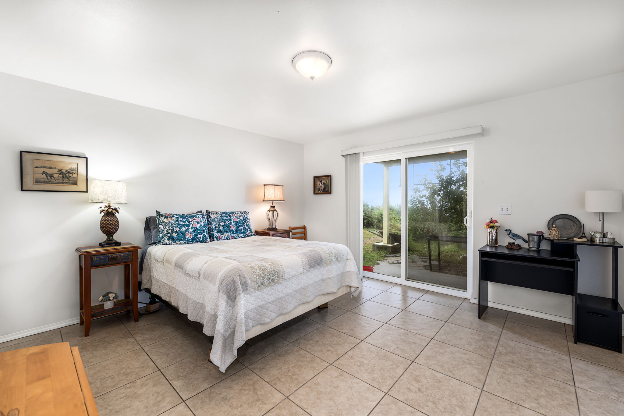 94-6494 Keoki Road Naalehu, HI 96772 - Photo 15 of 30 a bedroom with a bed and a window