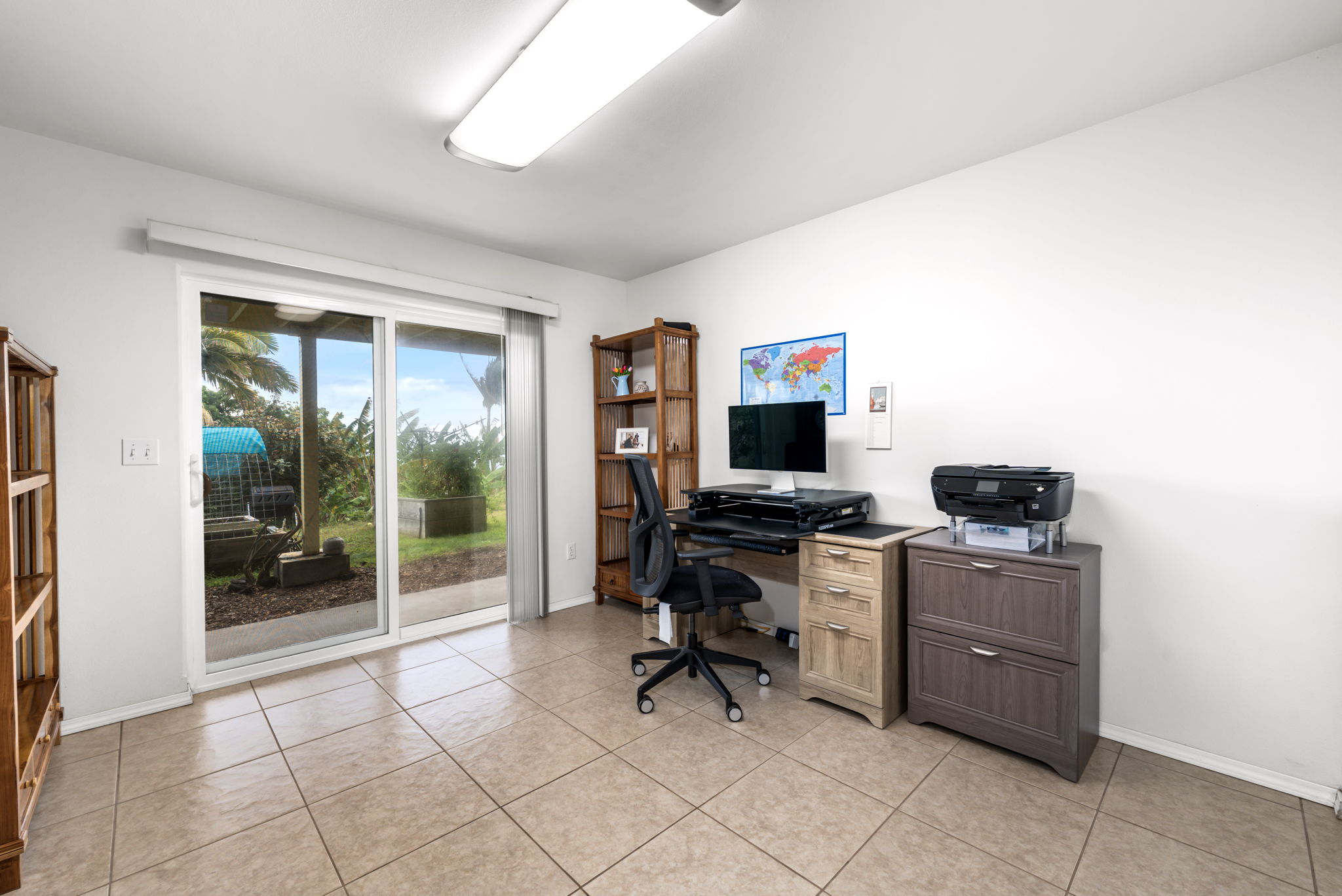 94-6494 Keoki Road Naalehu, HI 96772 - Photo 17 of 30 a view of a workspace with furniture and a window