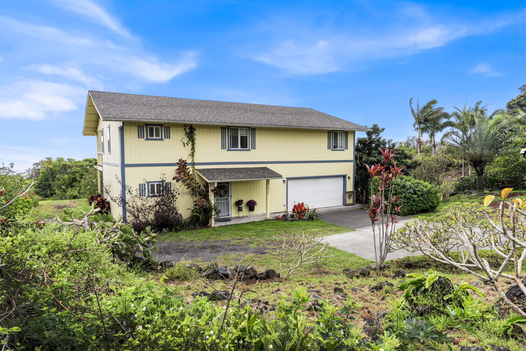 94-6494 Keoki Road Naalehu, HI 96772 - Photo 20 of 30 a view of a house with a yard