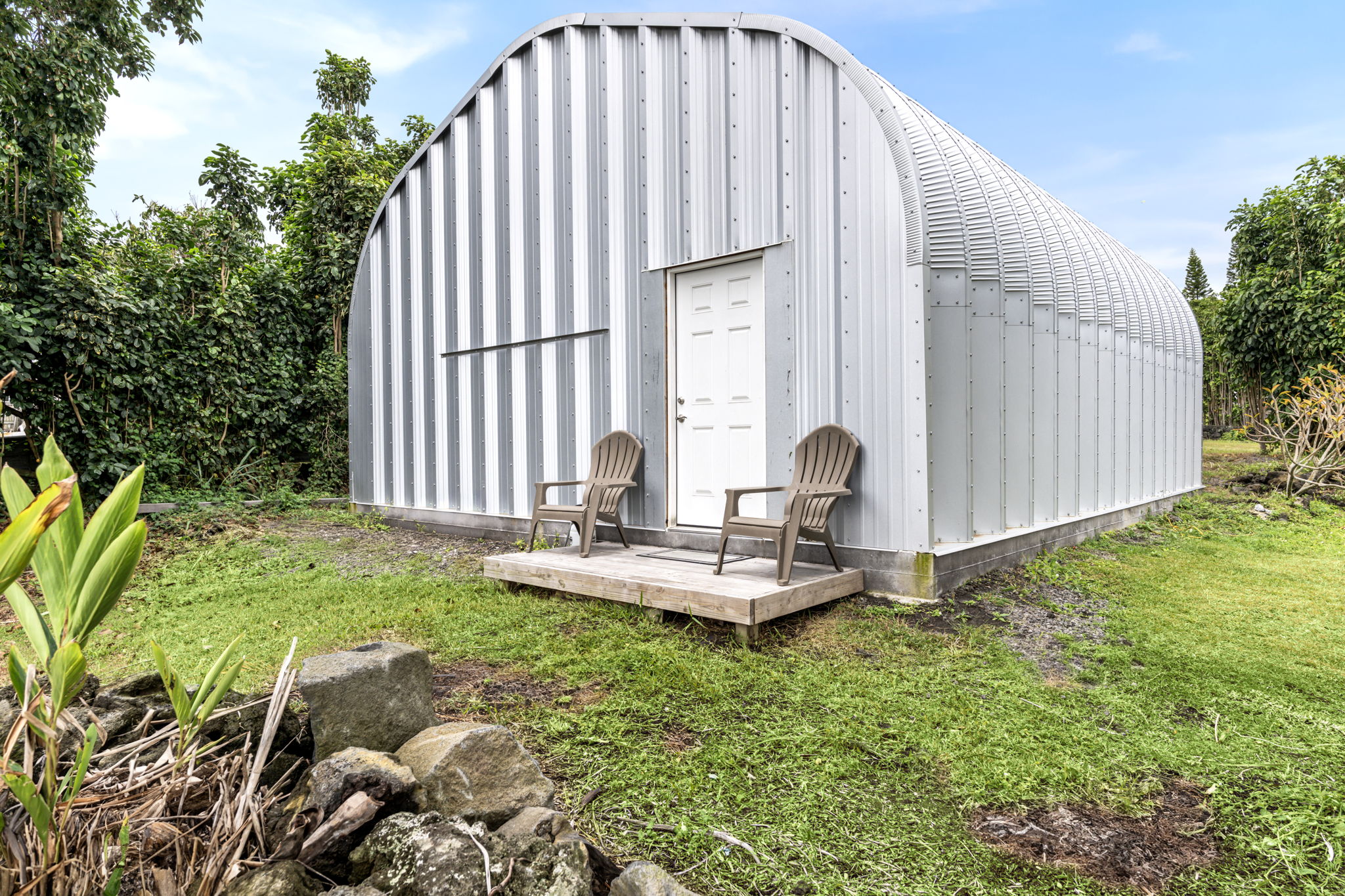 94-6494 Keoki Road Naalehu, HI 96772 - Photo 30 of 30 a front view of a house with garden