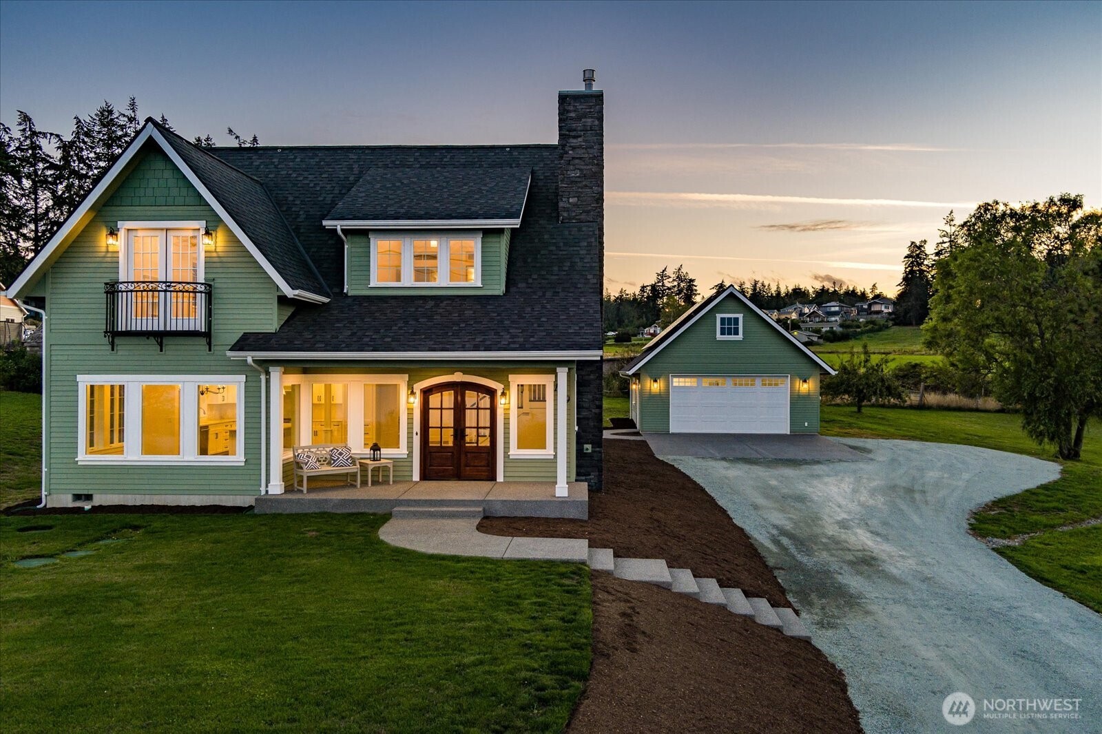 1649 West Scenic Heights Road Oak Harbor, WA 98277 - Photo 4 of 40 a front view of a house with a yard and garage