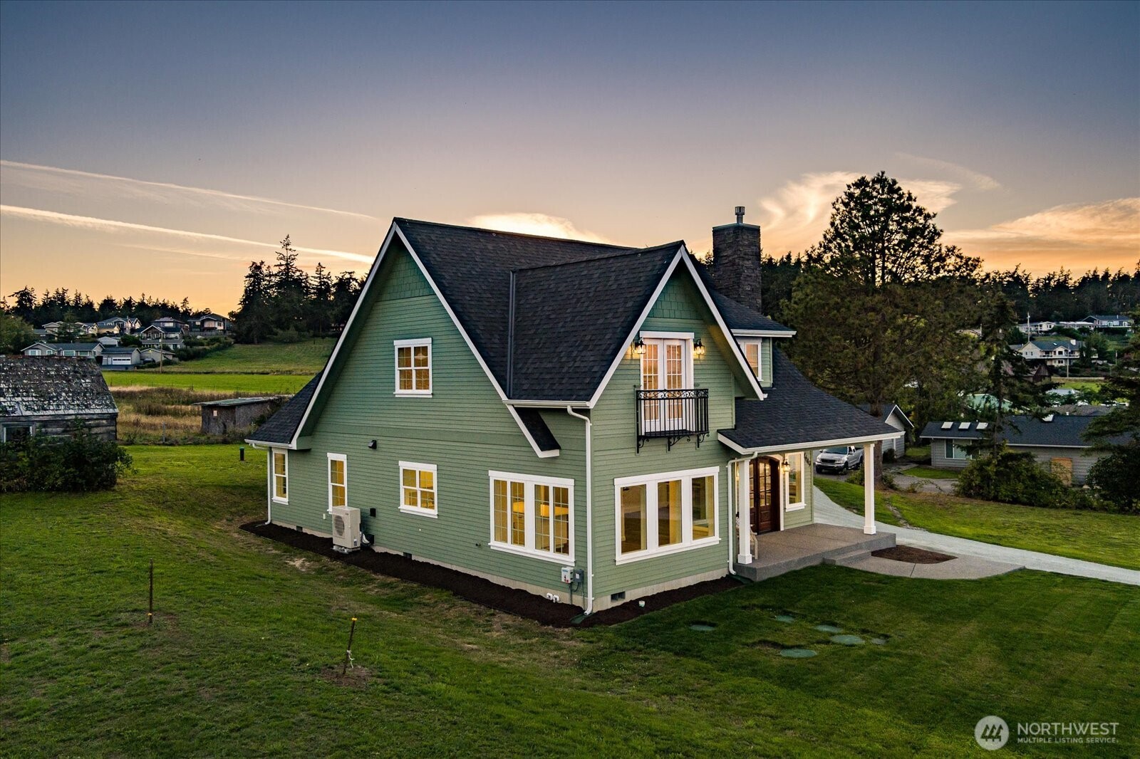 1649 West Scenic Heights Road Oak Harbor, WA 98277 - Photo 5 of 40 a aerial view of a house with a yard table and chairs