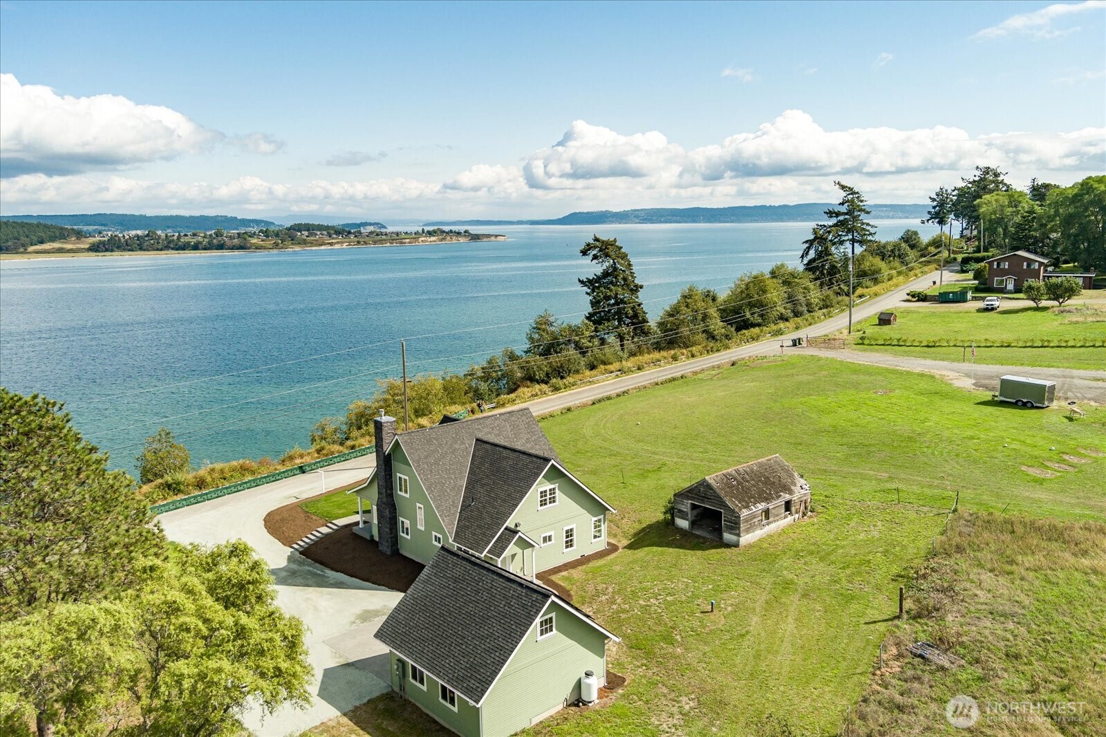 1649 West Scenic Heights Road Oak Harbor, WA 98277 - Photo 8 of 40 a view of a swimming pool and an ocean