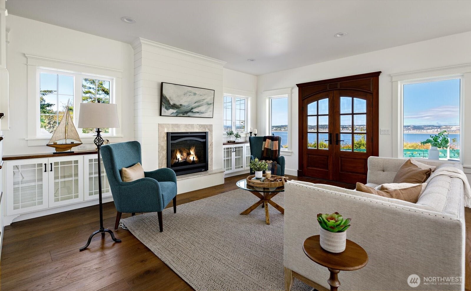 1649 West Scenic Heights Road Oak Harbor, WA 98277 - Photo 9 of 40 a living room with furniture fireplace and a table