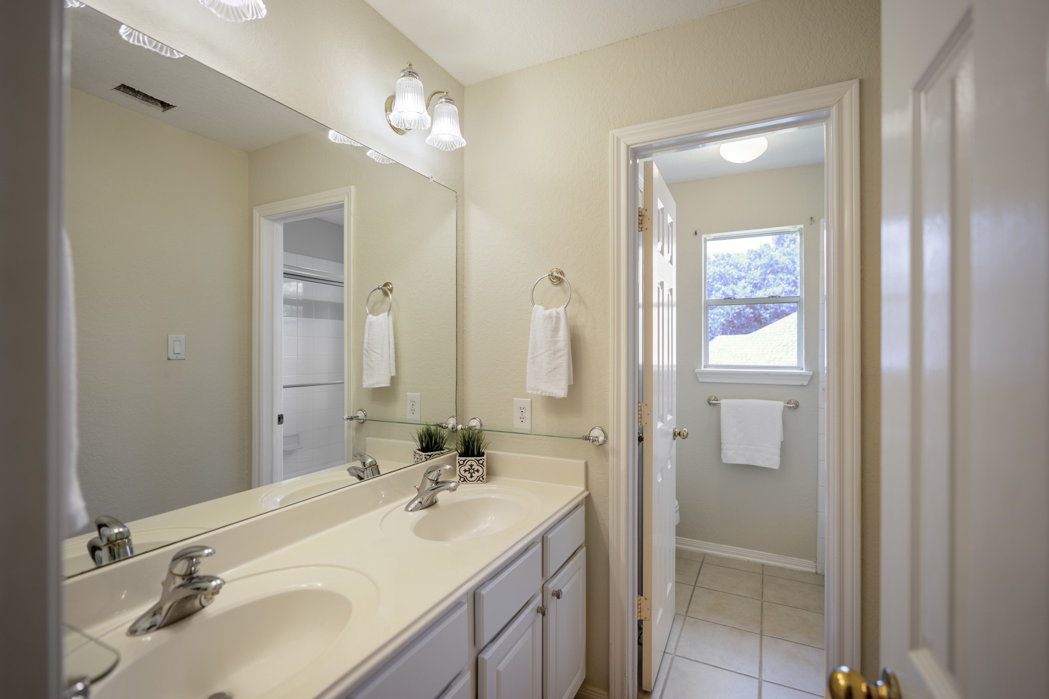 5807 Sequoia Trace Court Spring, TX 77379 - Photo 28 of 50 Upstairs, the shared bath is designed for easy use with a dual-sink vanity and a separate bath area, giving the secondary bedrooms added function and separation.