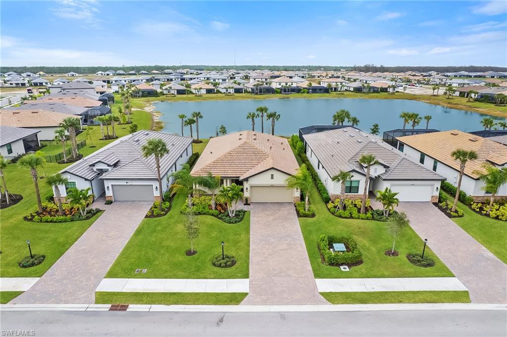 an aerial view of a house with garden space and ocean view