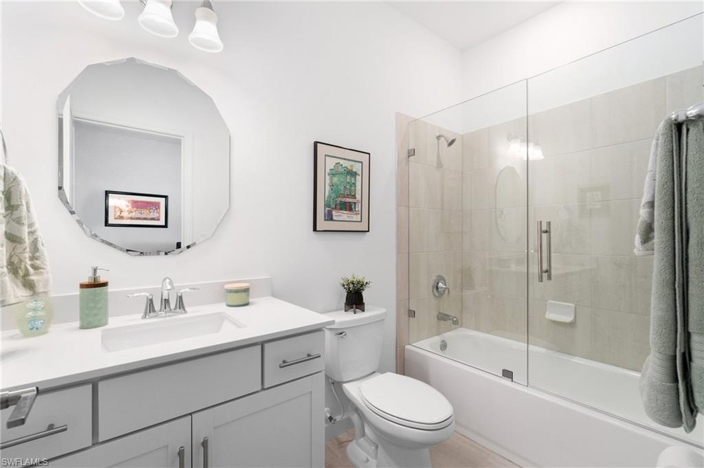 20238 Millrun Drive Estero, FL 33928 - Photo 27 of 41 a bathroom with a sink a toilet and shower