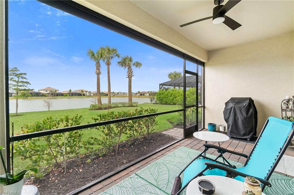 20238 Millrun Drive Estero, FL 33928 - Photo 28 of 41 a view of a balcony with chair and wooden floor