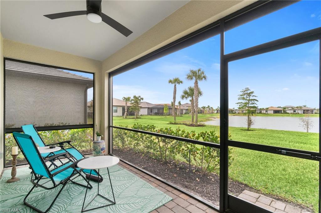20238 Millrun Drive Estero, FL 33928 - Photo 29 of 41 a view of a porch with furniture and garden view