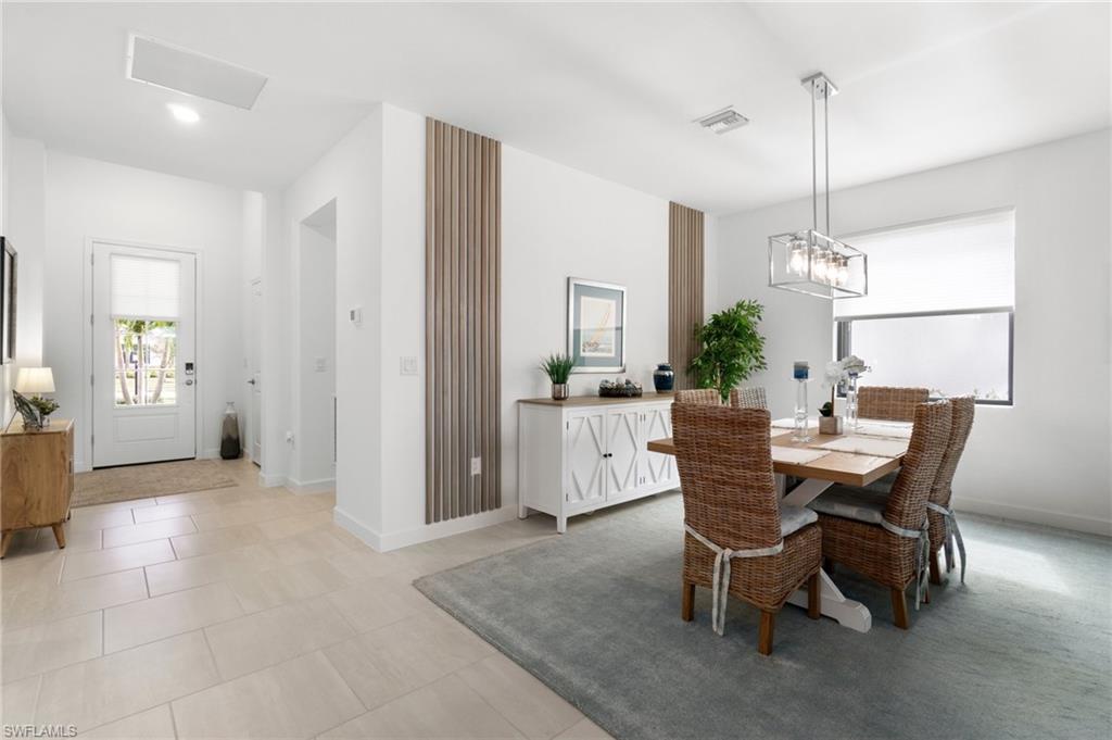 20238 Millrun Drive Estero, FL 33928 - Photo 7 of 41 a view of a dining room with furniture