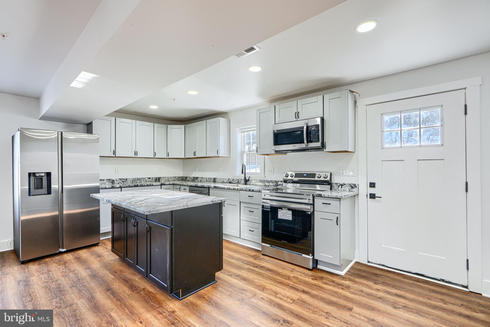1359 Pleasant Valley Road Westminster, MD 21158 - Photo 14 of 57 Modern kitchen with sleek finishes.