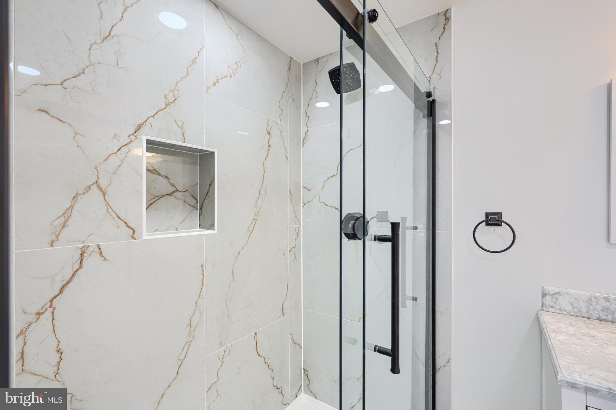 1359 Pleasant Valley Road Westminster, MD 21158 - Photo 37 of 57 Sleek modern shower with elegant marble tiles.