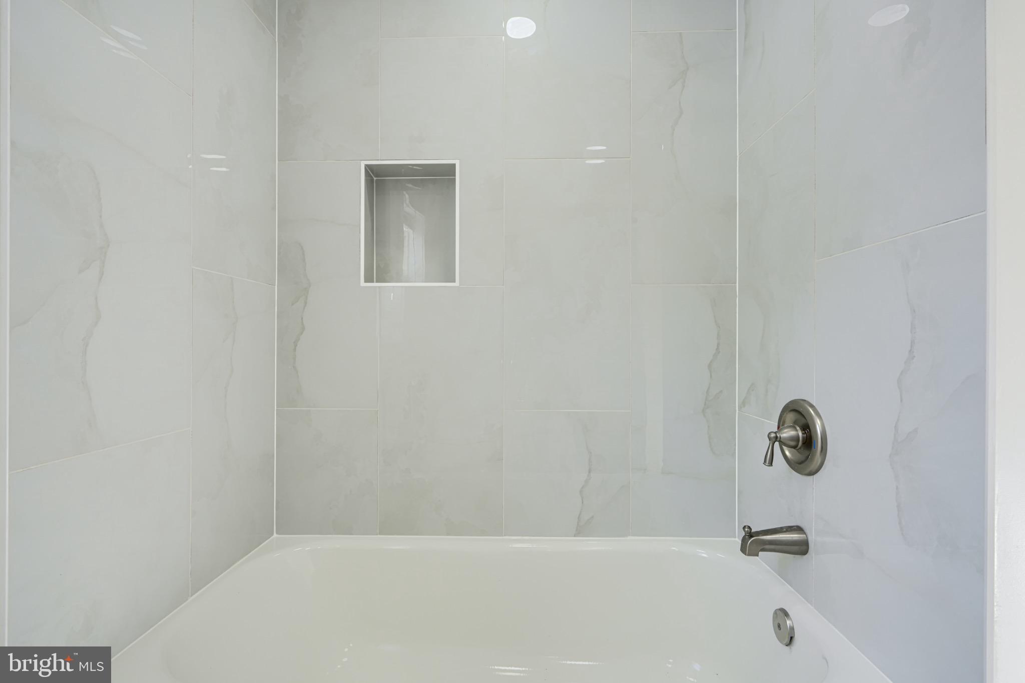 1359 Pleasant Valley Road Westminster, MD 21158 - Photo 41 of 57 Sleek modern shower with elegant tiles.