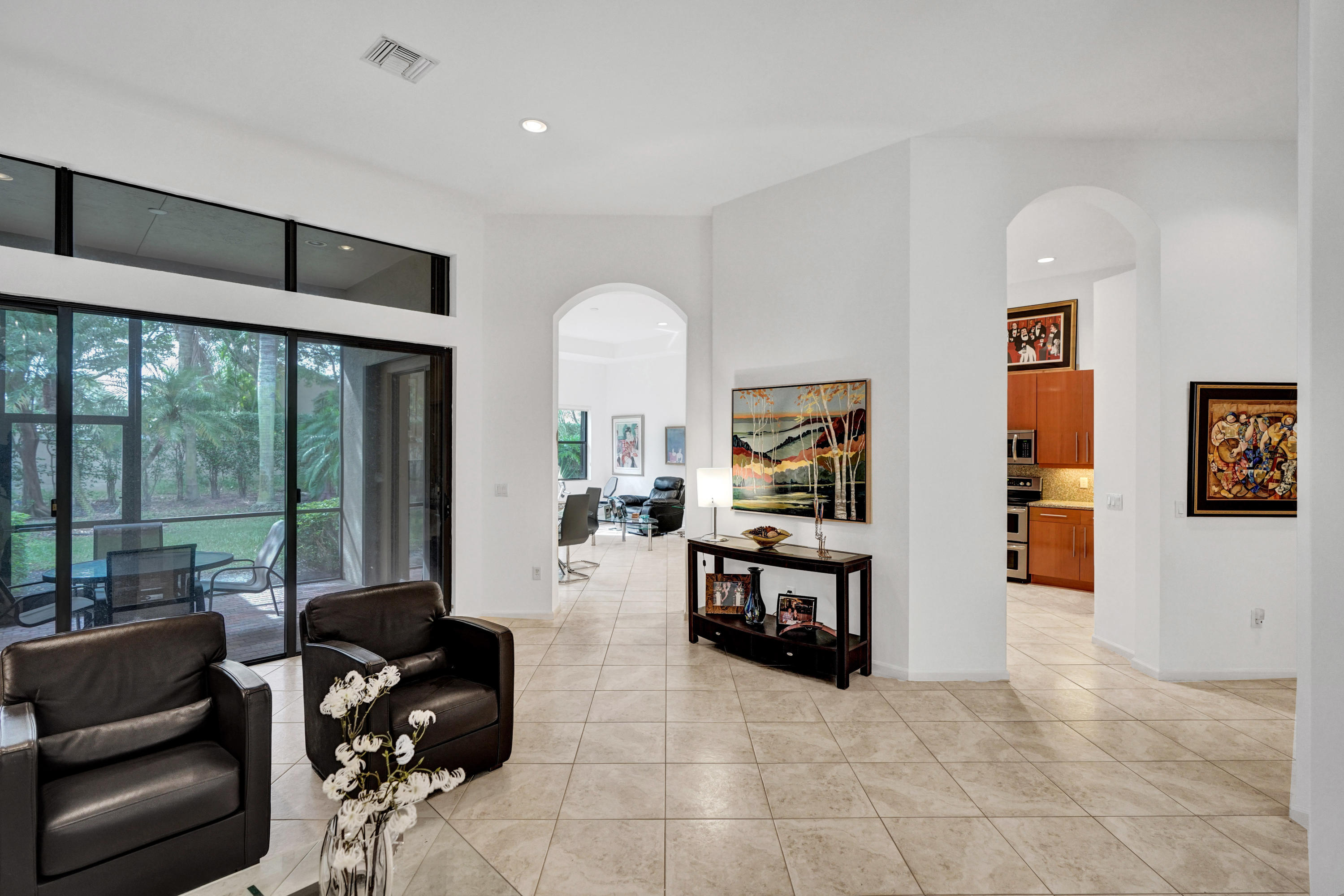 7849 Via Grande Boynton Beach, FL 33437 - Photo 20 of 59 a living room with furniture large window and table