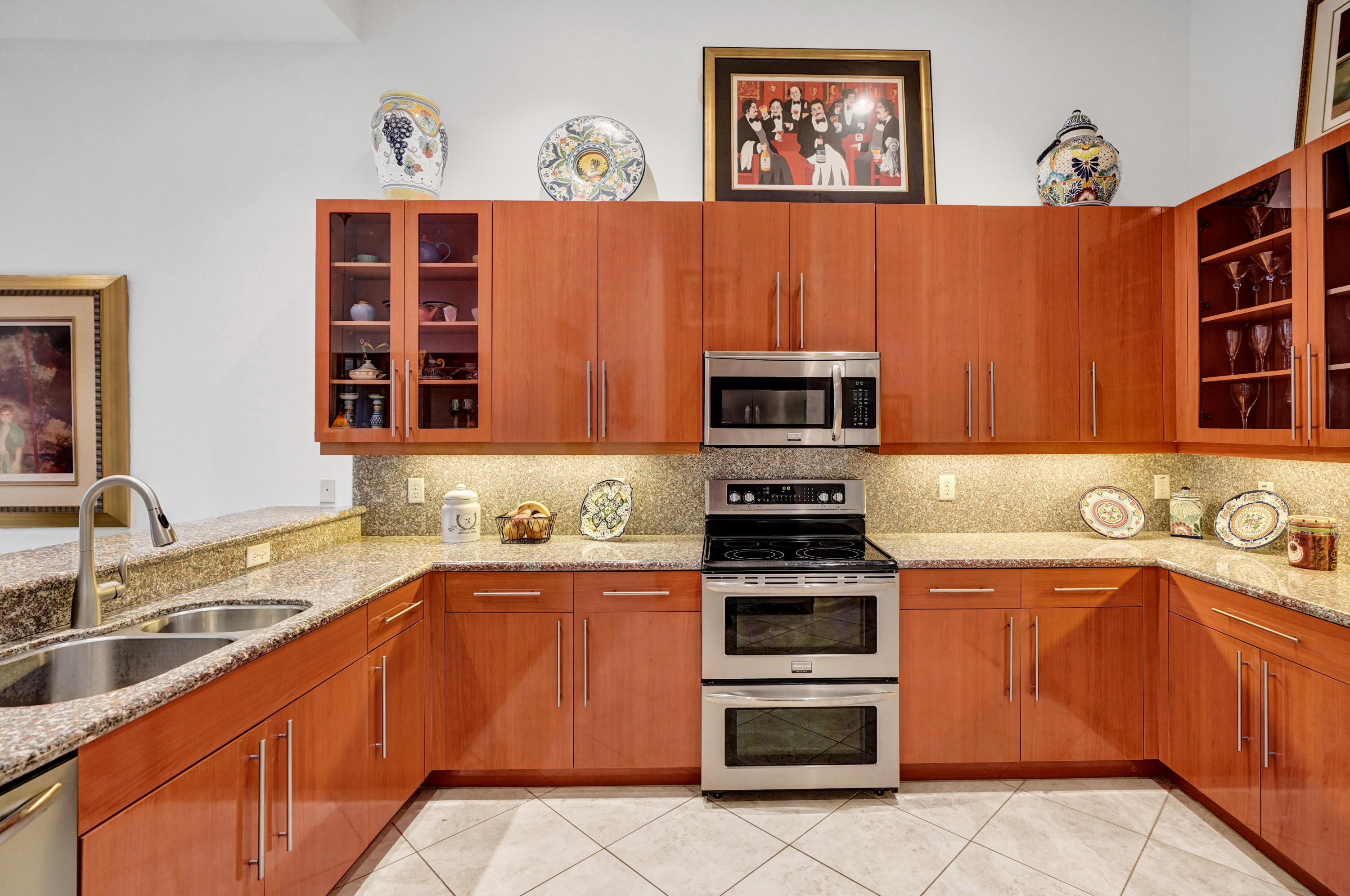 7849 Via Grande Boynton Beach, FL 33437 - Photo 28 of 59 a kitchen with stainless steel appliances a stove top oven