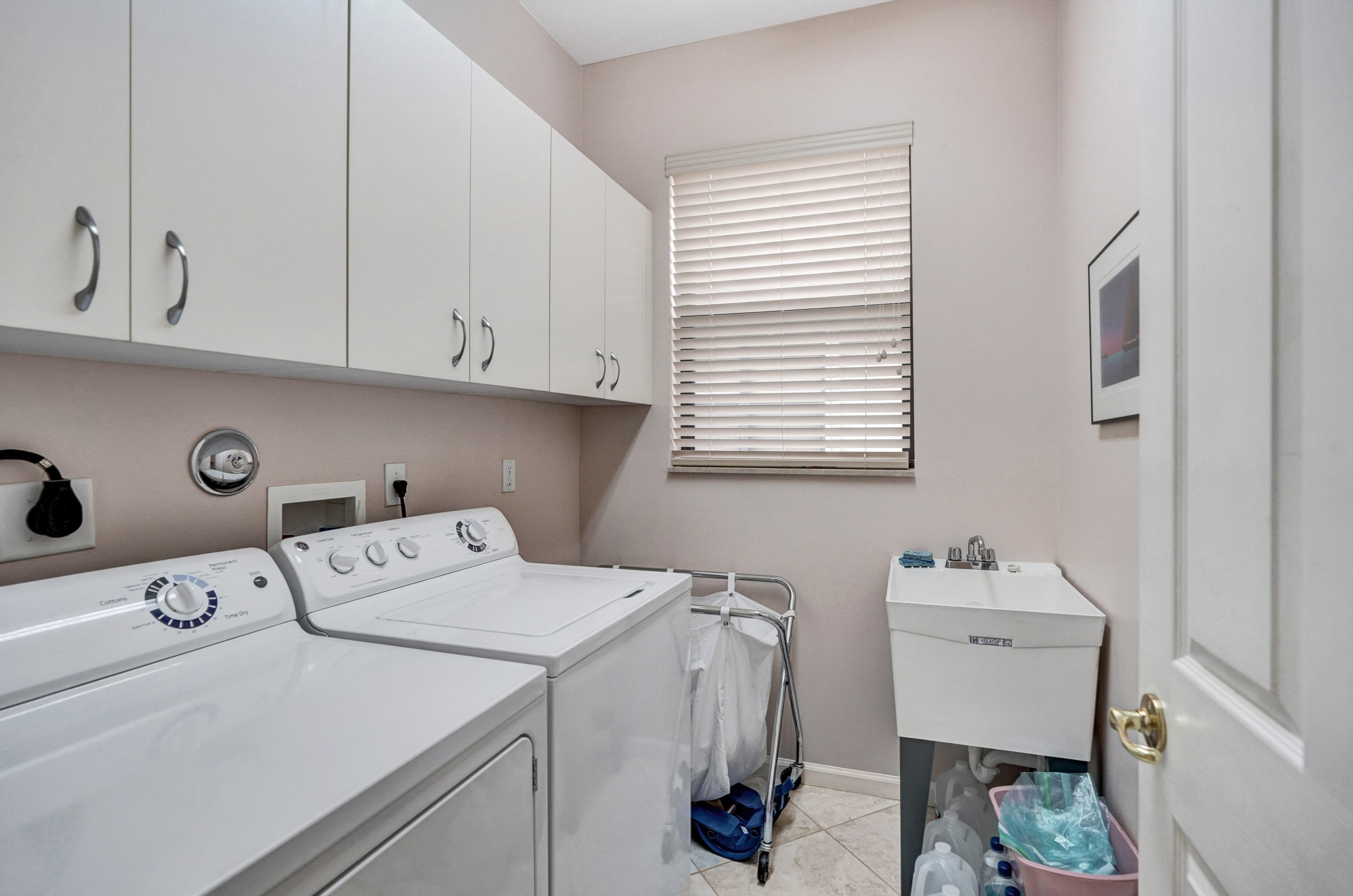 7849 Via Grande Boynton Beach, FL 33437 - Photo 33 of 59 a utility room with dryer and washer
