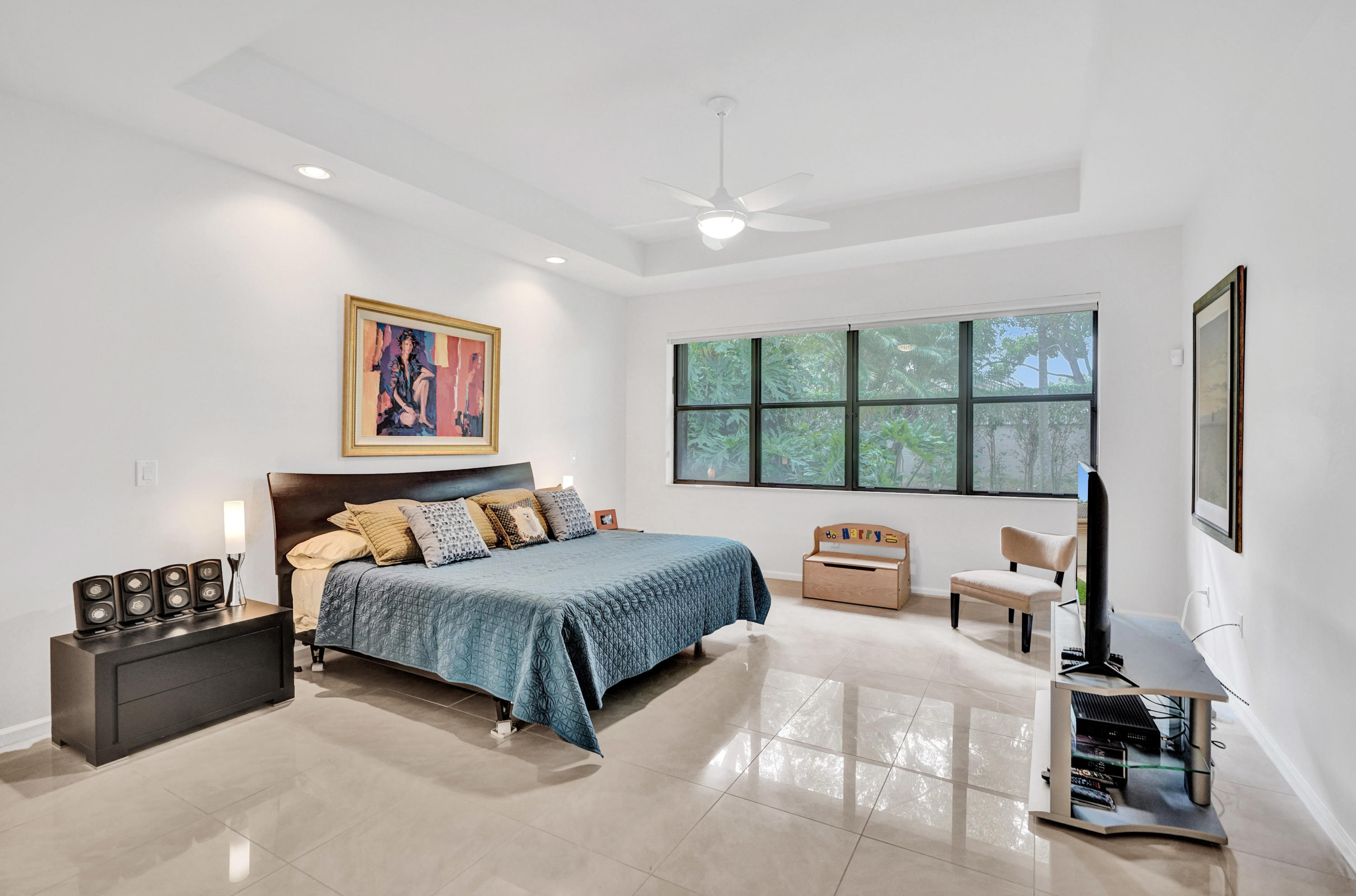 7849 Via Grande Boynton Beach, FL 33437 - Photo 43 of 59 a bedroom with a bed a couch and a window