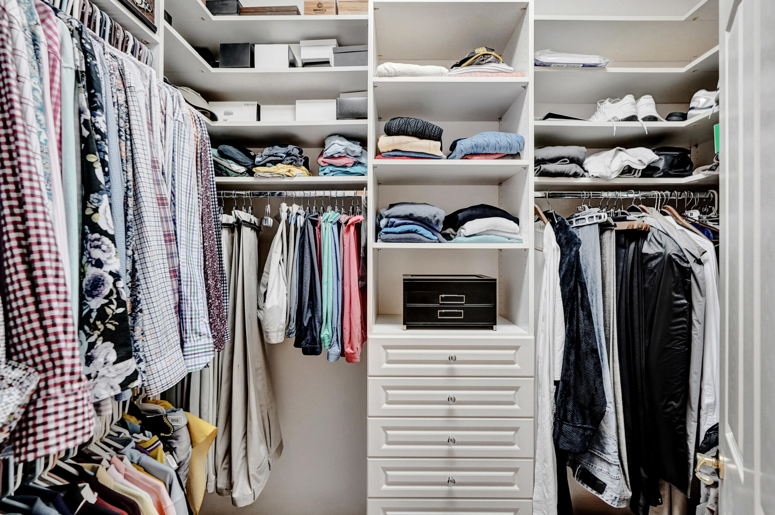 7849 Via Grande Boynton Beach, FL 33437 - Photo 48 of 59 a view of walk in closet with clothes and shoes