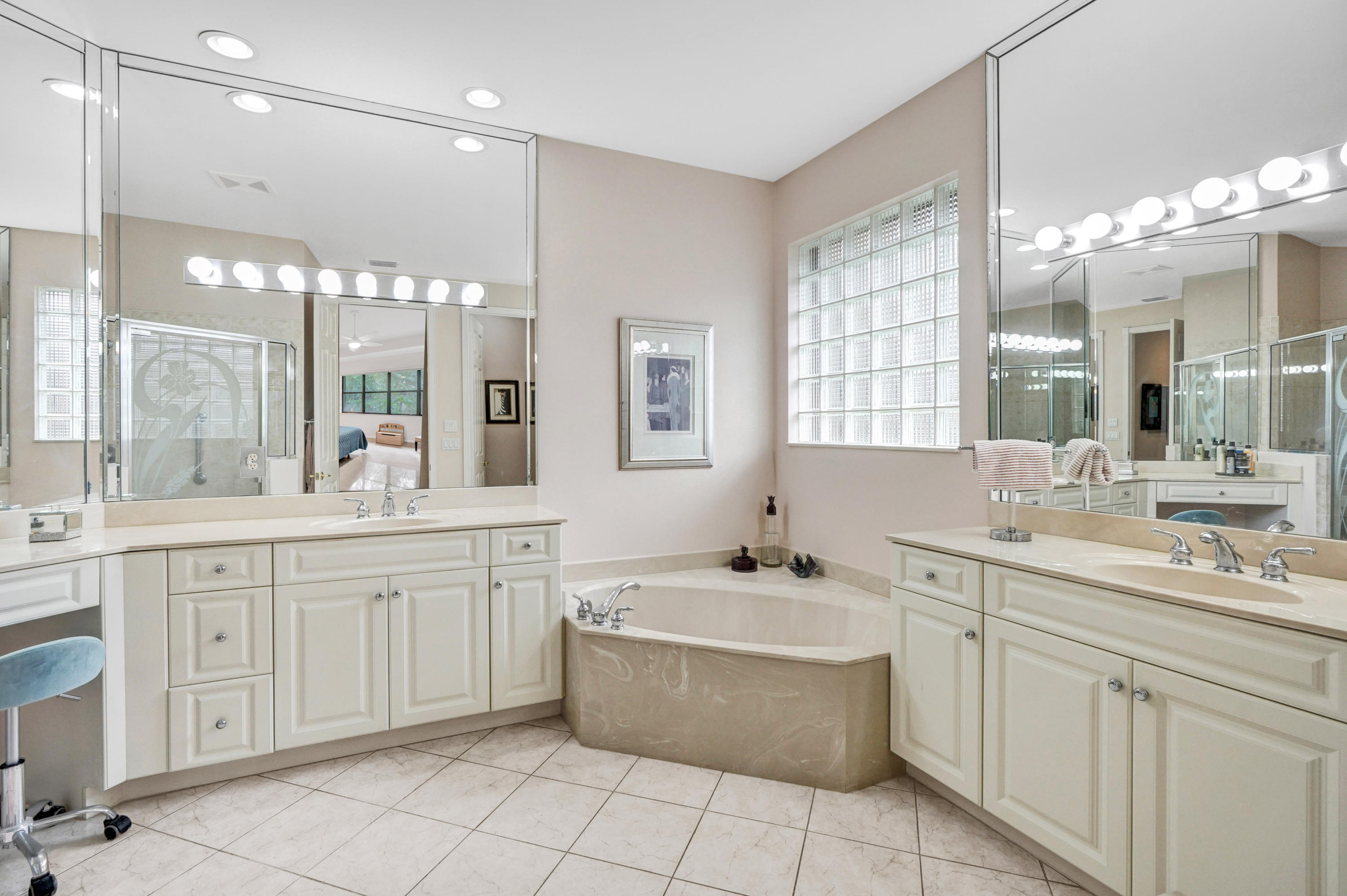 7849 Via Grande Boynton Beach, FL 33437 - Photo 50 of 59 a large bathroom with a double vanity sink mirror and bathtub