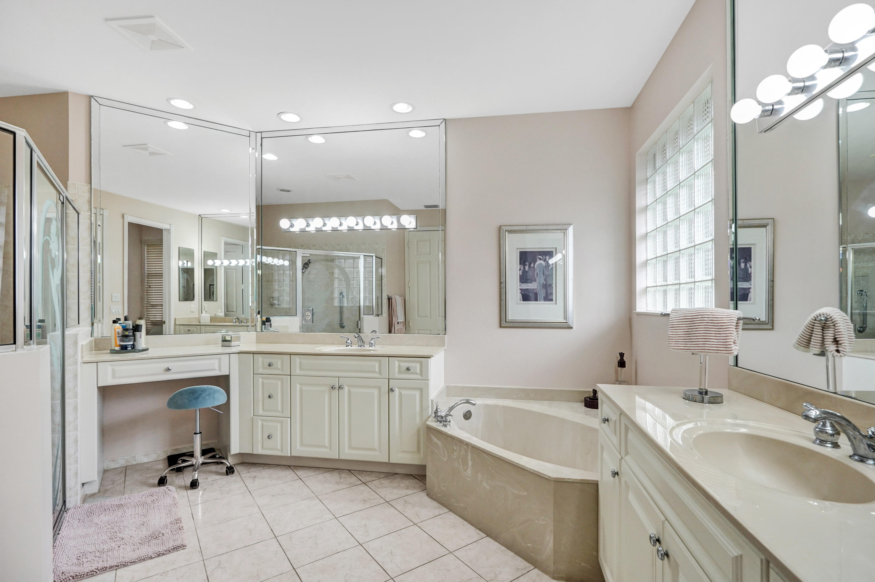 7849 Via Grande Boynton Beach, FL 33437 - Photo 51 of 59 a bathroom with a tub a sink double vanity granite and a mirror