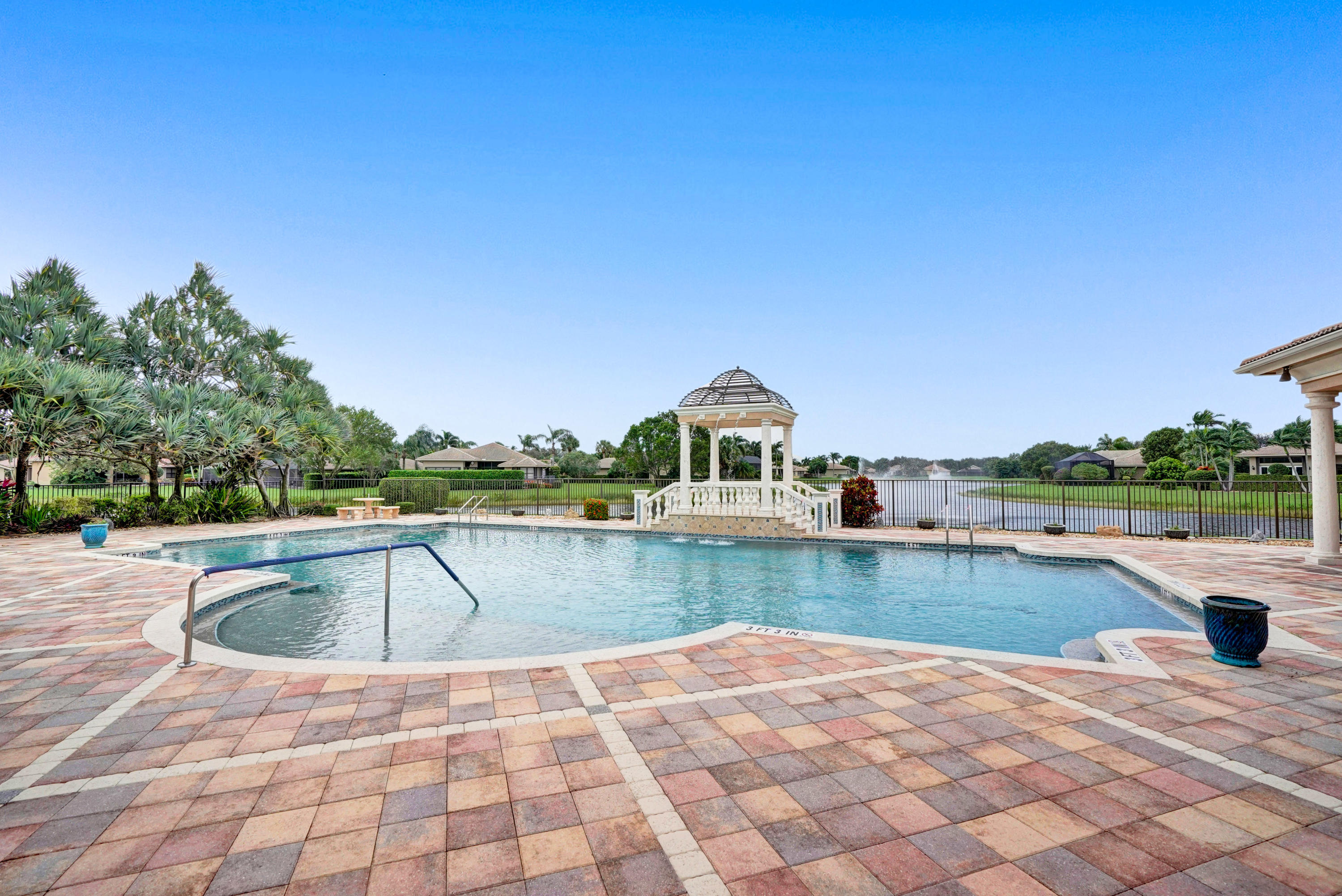 7849 Via Grande Boynton Beach, FL 33437 - Photo 57 of 59 a view of a swimming pool with a lounge chair