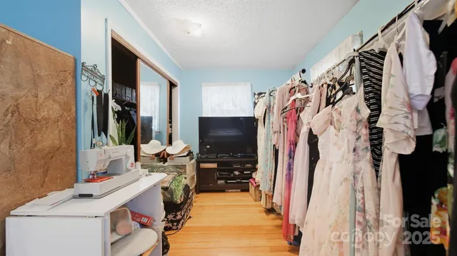a room with furniture and a walk in closet