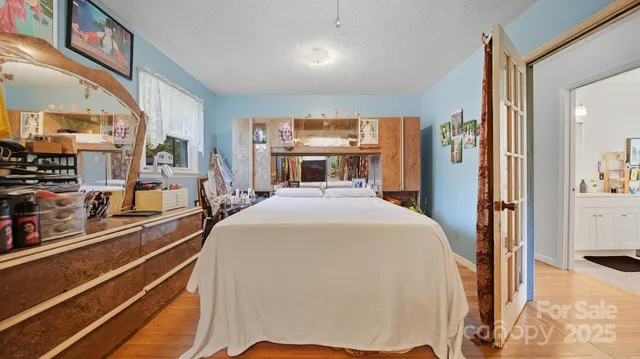 a bed room with a bed and a large window