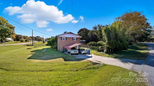 a childrens park with lots of trees and slides