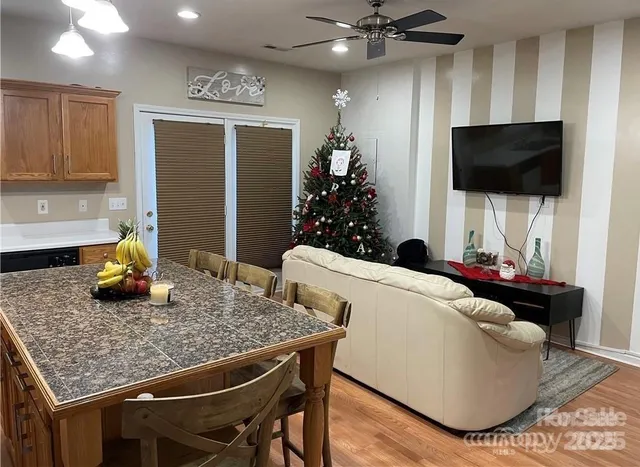 a living room with furniture and a flat screen tv